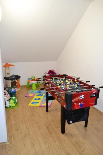 a room with a foosball table in the corner of a room at Ubytovanie Athéna in Poprad