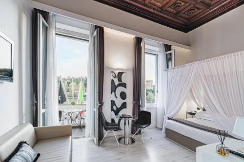 a living room with a large window at LHP Hotel River & SPA in Florence