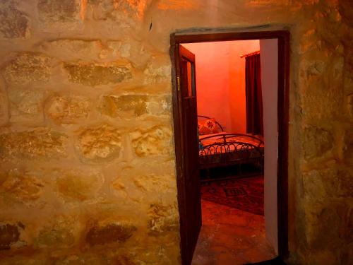 a doorway to a bedroom with a bed in a room at The Orient Home in Wadi Musa