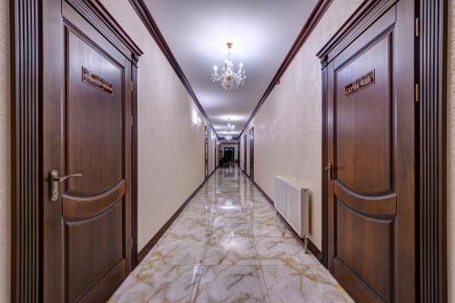 a hallway with two doors and a corridorngth at Continental SPA Resort in Bukovel