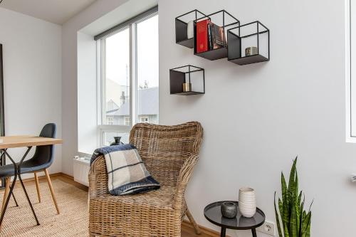 a living room filled with furniture and a window at Tyr Apartments in Reykjavík
