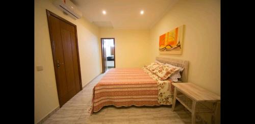 Ένα ή περισσότερα κρεβάτια σε δωμάτιο στο Magnólia