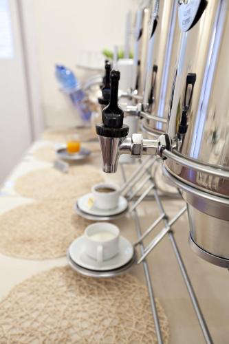 a table with plates and cups on a counter at Tenuta Quadrifoglio in Gambassi Terme
