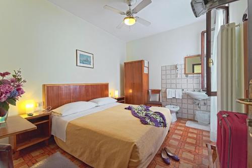 Postel nebo postele na pokoji v ubytování Albergo Al Gobbo