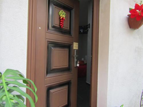 a door with a christmas wreath on it at Tufaro B&B Private Room in Macerata Campania
