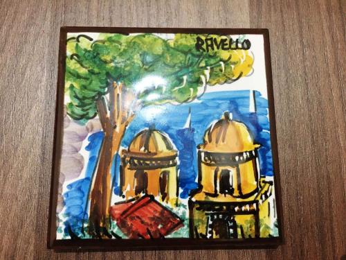 a picture of a painting of a tree and buildings at B & B Evergreen in Corbara