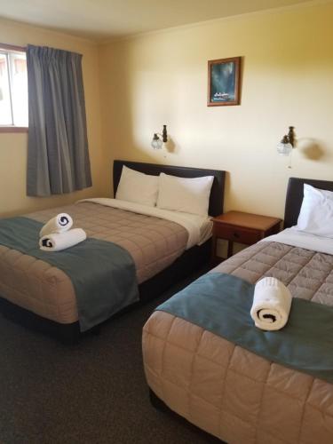 Postel nebo postele na pokoji v ubytování Alpine View Motel