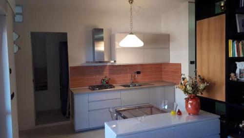 a kitchen with a sink and a counter top at GUFO VERDE in Sulmona