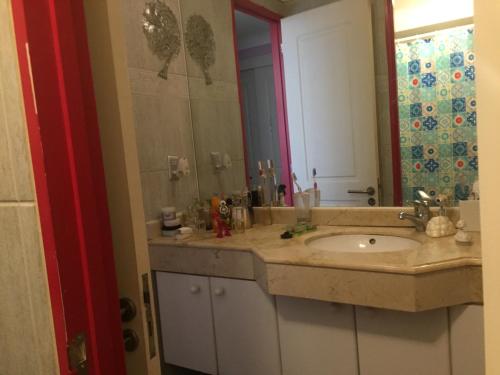 a bathroom with a sink and a mirror at Playa Miramar in Viña del Mar