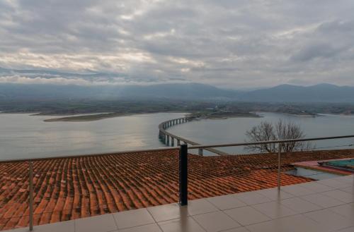 a view of a body of water with a bridge at Vai Guesthouse Neraida in Neráïdha