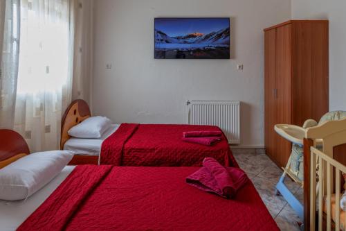 Posteľ alebo postele v izbe v ubytovaní Vai Guesthouse Neraida