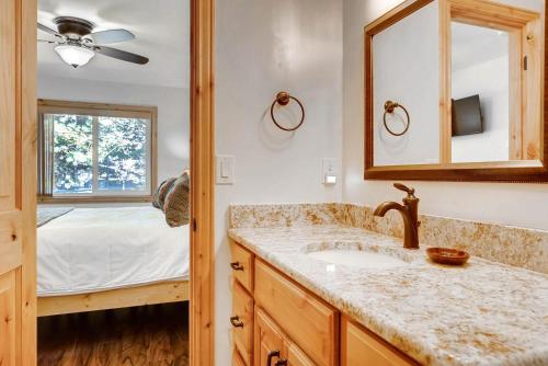 a bathroom with a sink and a bedroom at Red Pine #K7 in Park City