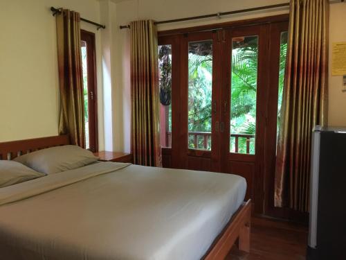 Pai Loess Resort tesisinde bir odada yatak veya yataklar