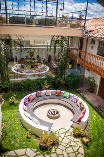 an aerial view of a backyard with a fire pit at Home Garden Hotel in Cusco