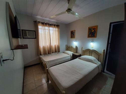 Ένα ή περισσότερα κρεβάτια σε δωμάτιο στο Hotel Mola