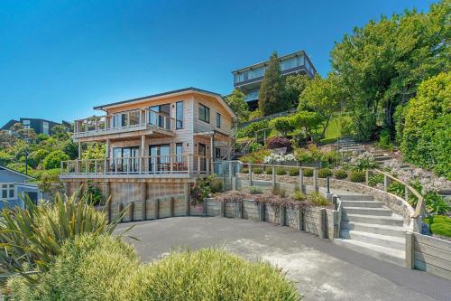 a house with a staircase leading up to it at Haulashore Vista in Nelson