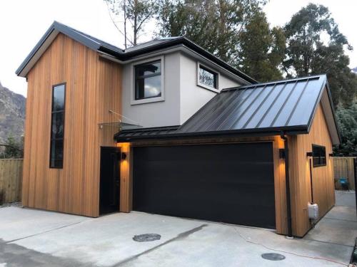 a garage with a metal roof on top of it at Coronet Haven in Queenstown