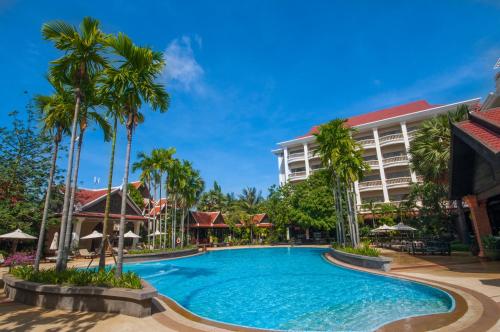 a swimming pool in front of a hotel at Borei Angkor Resort & Spa in Siem Reap