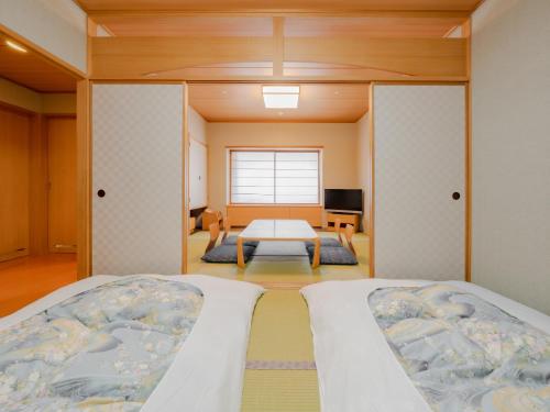 Ένα ή περισσότερα κρεβάτια σε δωμάτιο στο Sapporo View Hotel Odori Park