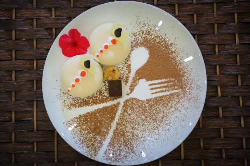 a plate of food with two duck cookies on it at فندق جولدن نايت Golden Night Hotel in Najran