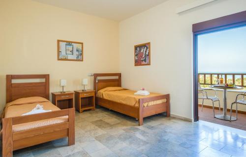 Posteľ alebo postele v izbe v ubytovaní ERIA RESORT for people with special abilities