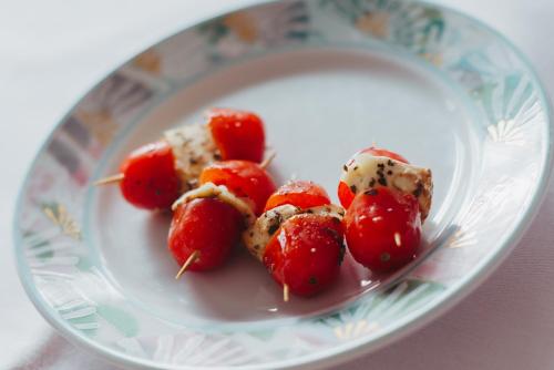 a plate of food with strawberries on it at Hotel Angermeier GARNI in Eching