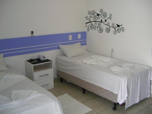 Ένα ή περισσότερα κρεβάτια σε δωμάτιο στο Hotel Ponta de Areia