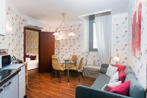 a living room with a couch and a table at Residenza Echia in Naples