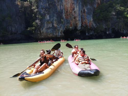 a group of people riding on rafts in the water at Kata S. T. House in Kata Beach