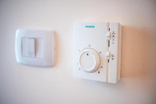 a lightswitch on a wall on a wall at Hotel Imperial Premium in Timişoara