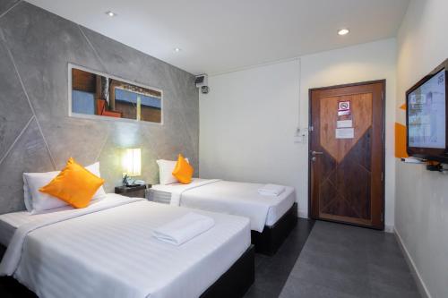 Postel nebo postele na pokoji v ubytování @ Border Hotel, Aranyaprateth
