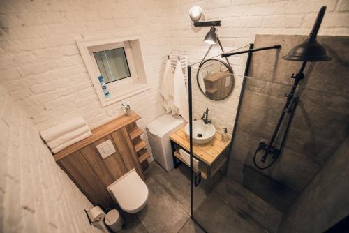 a bathroom with a shower and a toilet and a sink at Relax House Narty in Narty