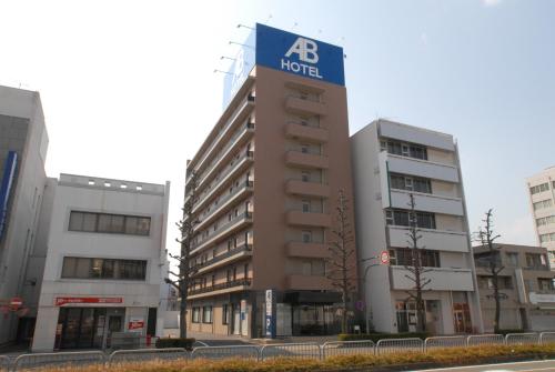a building with a hotel sign on top of it at AB Hotel Gifu in Gifu