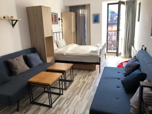 Postel nebo postele na pokoji v ubytování Studio apartment #507 in Gudauri Loft