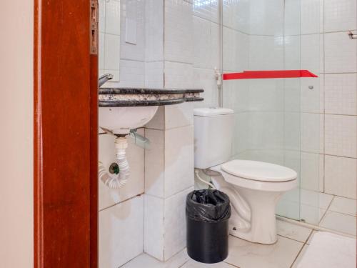 a bathroom with a toilet and a sink at Pousada Ilha Costeira in São Luís