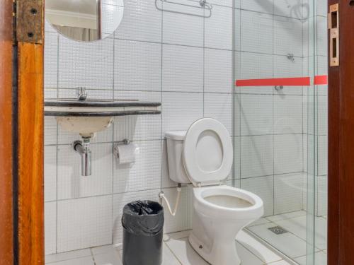 a bathroom with a toilet and a sink at Pousada Ilha Costeira in São Luís