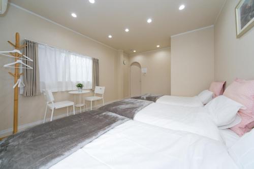 Katil atau katil-katil dalam bilik di Nao's Guesthouse 2 一軒家貸切