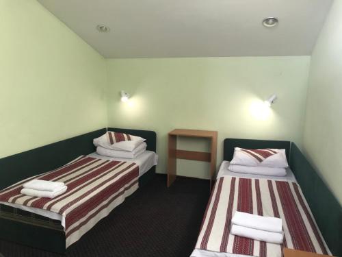 Ένα ή περισσότερα κρεβάτια σε δωμάτιο στο Hotel 18