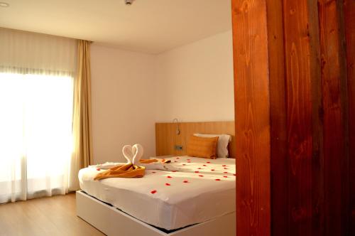 Postel nebo postele na pokoji v ubytování Hotel Da Luz