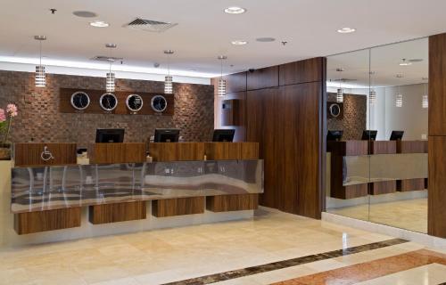 a lobby of a dental office with a reception counter at Intercity São Paulo Ibirapuera in Sao Paulo