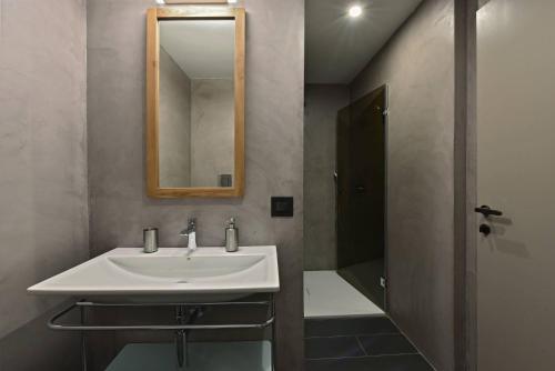 a bathroom with a sink and a mirror at Villa Pirreca in Favignana