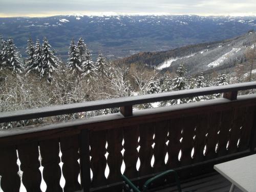 a view of a snow covered mountain from a balcony at Alpengasthaus Sonnhof in Goding