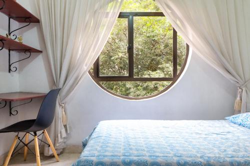 Postel nebo postele na pokoji v ubytování Casa Entera-Cerca a Mall La Central y Estación de Tranvía