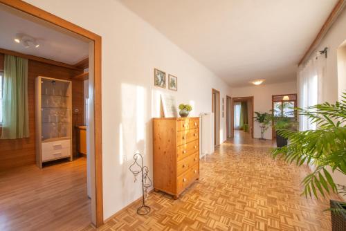 a hallway of a home with a dresser in the middle at Haus Karl in Ebensee