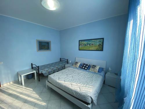 Postel nebo postele na pokoji v ubytování B&B Il Moai