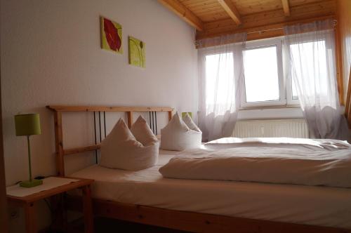 Katil atau katil-katil dalam bilik di Weingut Landmann Ferienwohnungen