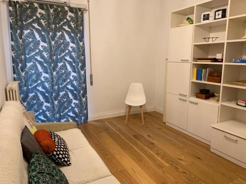 a living room with a couch and a chair at Casa Mentana in Terni