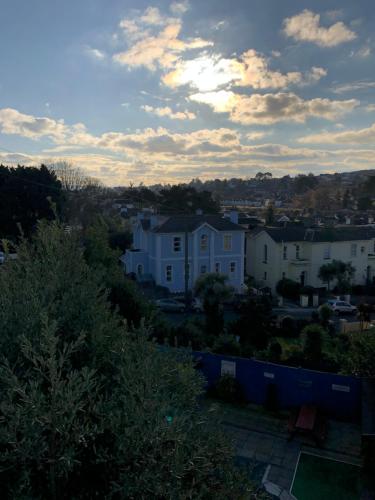 a view of a city with houses and a cloudy sky at The Purple Tree Guest House in Torquay