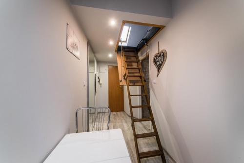 a small room with a stairs leading to a room at Hugo in Krakow