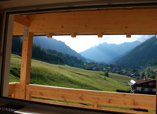 a view from a window of a mountain valley at Apart Ideal in Lermoos
